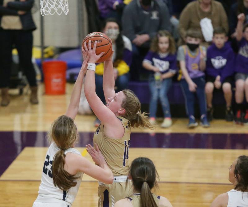 Serena's Reese Cole (14) looks to score a basket as Ridgeview's Peyton Rinkenberger (23) defends in the Class 1A Supersectional game on Monday Feb. 28, 2022 in Serena.