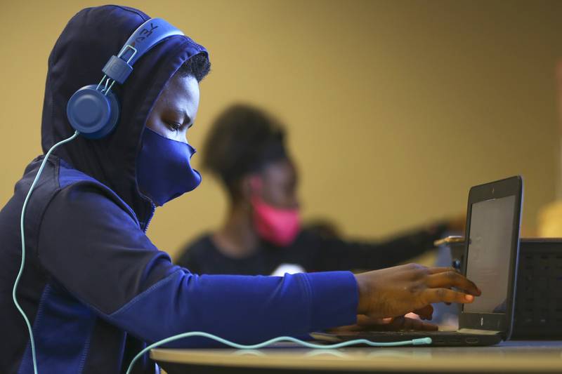 Tyrone Stone, 10, participates in his online class on Monday, Nov. 9, 2020, at the Salvation Army Joliet Community Center in Joliet, Ill. The Greater Joliet Area YMCA is one of the community partners of the United Way of Will County.