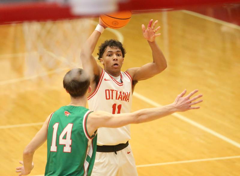 Ottawa's Hezekiah Joachim looks to pass the ball around L-P's Wyatt Kilday on Friday, Feb. 6, 2026 in Kingman Gymnasium at Ottawa High School.