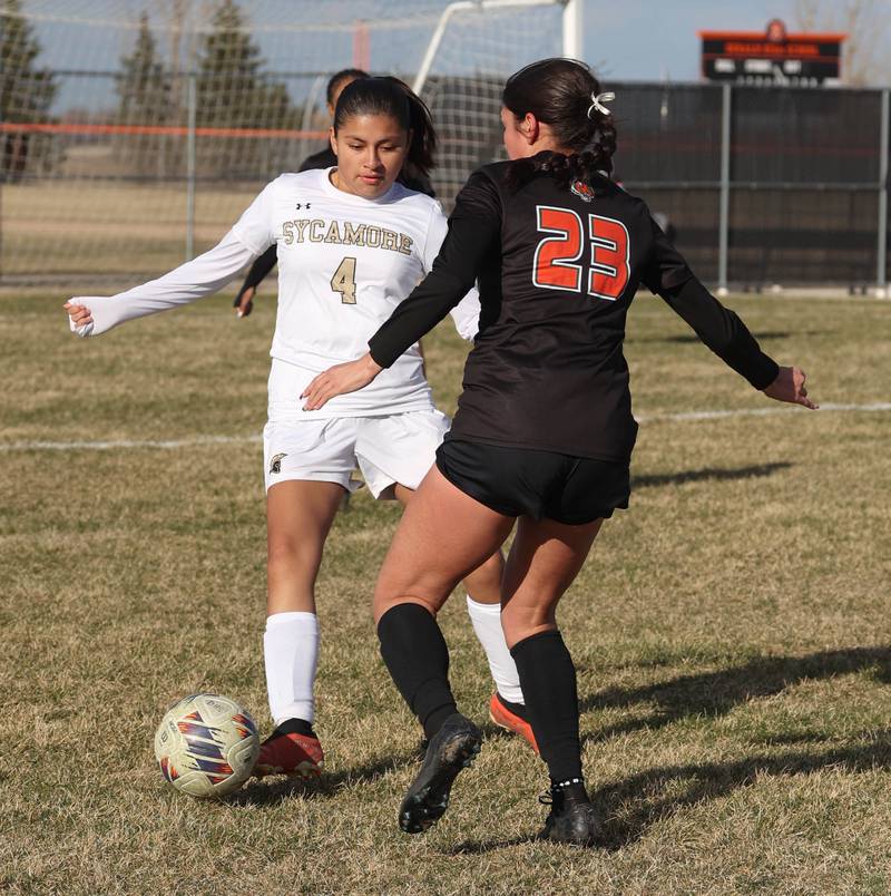Plainfield East's Gabriella Sanchez tries to get by Sycamore's Karyme Jimenez during their game Tuesday, March 25, 2025, in the Barb Fest tournament at DeKalb High School.