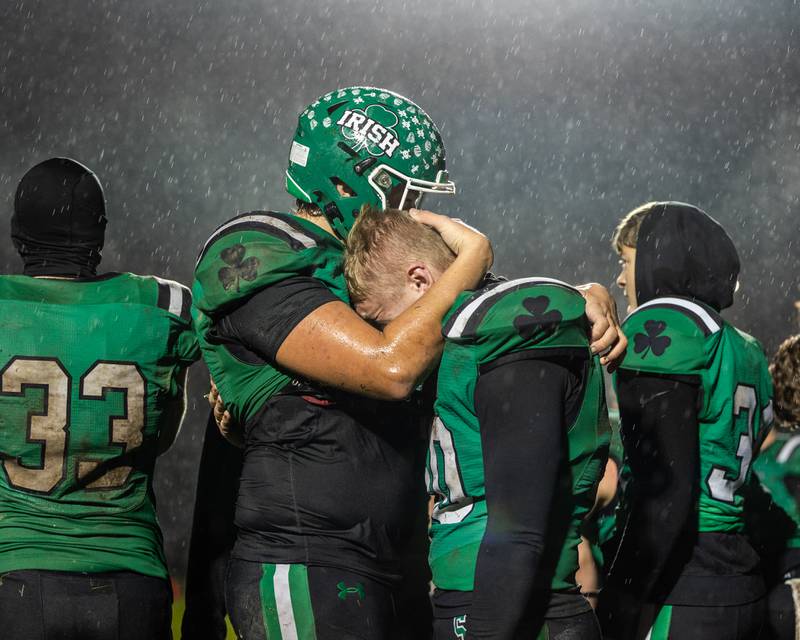 Seneca players embrace one another after playoff loss to Wilmington on Saturday, November 8, 2025 at Seneca High School in Seneca.