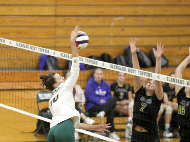 Glenbard West’s Marin Johnson goes up for a kill during a home game against Lyons Township in Glen Ellyn on Tuesday, Oct. 10, 2023.