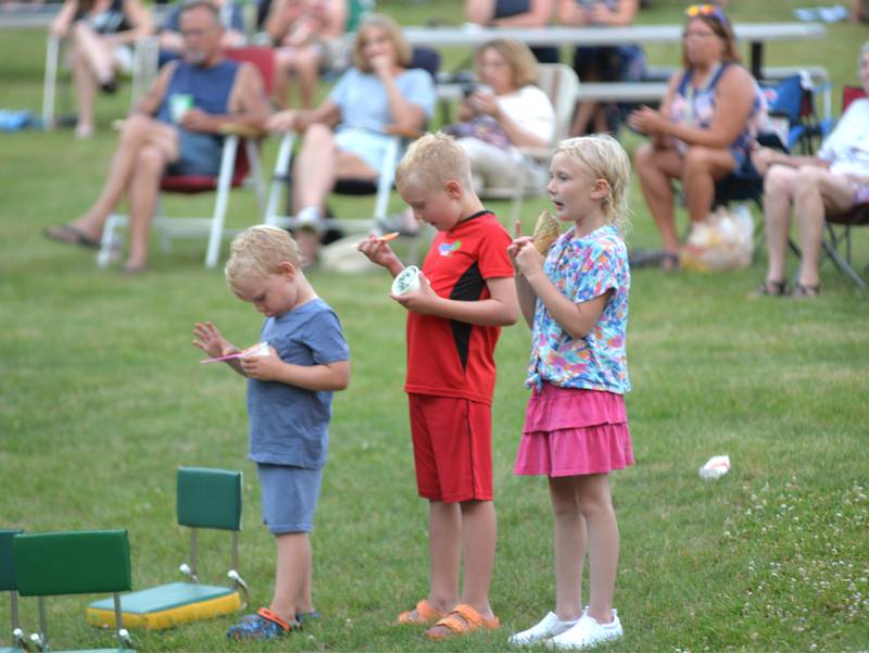 Kids enjoy their ice cream at Oregon Park West as “Buzzed by SonSET,” performs at the Oregon Park District’s Concert in the Park on Tuesday, June 24. Food vendors, including the Just 4 Fun ice cream truck, offer a variety of items for purchase during the concerts.