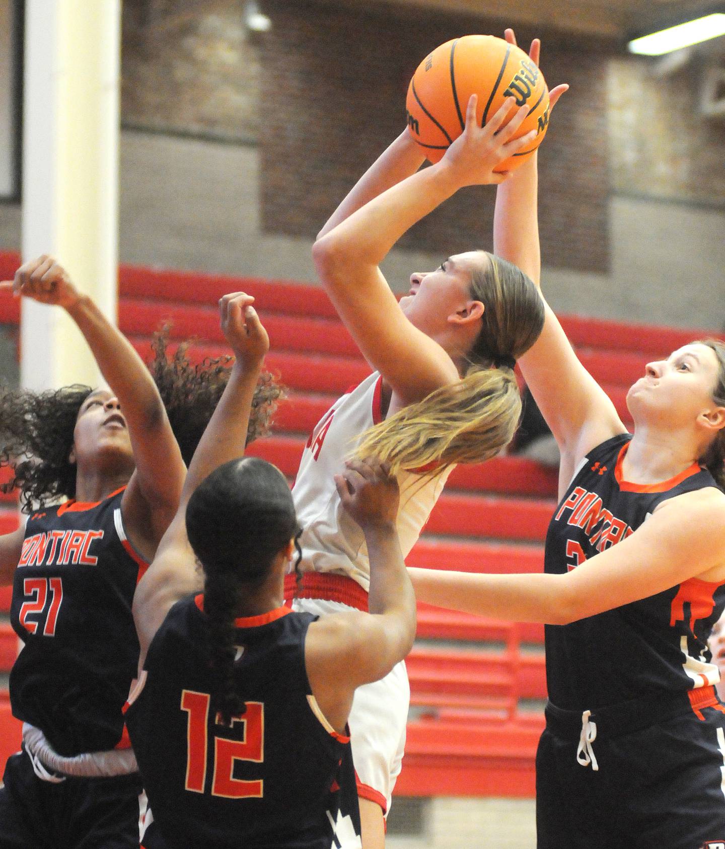 Ottawa's Ashlynn Ganiere shoots as Pontiac's Grace Lanning gets a hand on the ball in the Ottawa Girls Holiday Tournament third place game on Tuesday, Dec. 23, 2025 in Kingman Gymnasium.Ottawa's Ashlynn Ganiere shoots as Pontiac's Grace Lanning gets a hand on the ball in the Ottawa Girls Holiday Tournament third place game on Tuesday, Dec. 23, 2025 in Kingman Gymnasium.