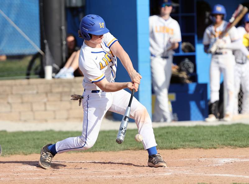 Lyons Township's Patrick Engels (23) makes contact during the boys varsity baseball game between Lyons Township and Downers Grove North high schools in Western Springs on Tuesday, April 11, 2023.