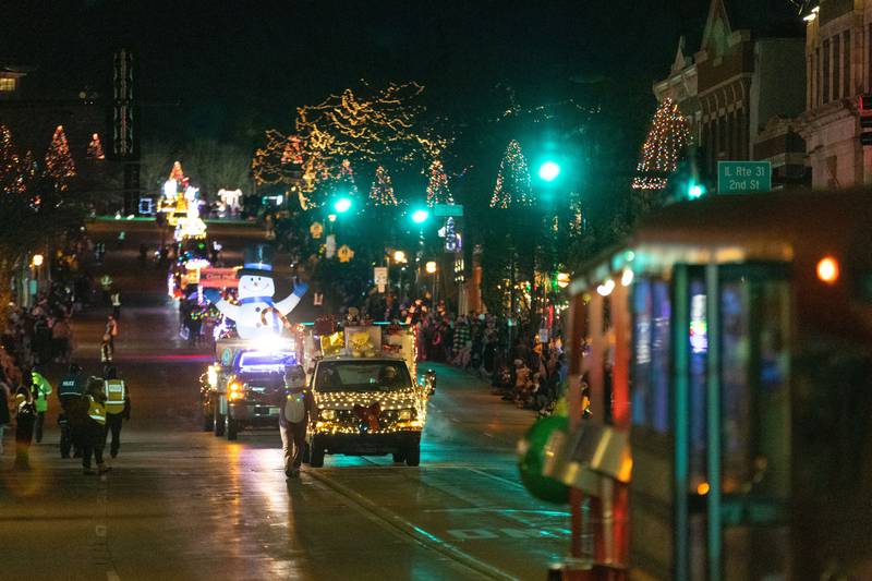 Floats process down Main Street in St. Charles during the Holiday Homecoming Electric Christmas Parade on Saturday, Nov. 30, 2024.