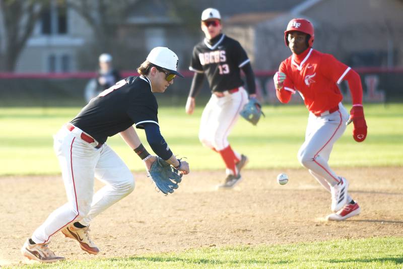 Bradley-Bourbonnais' Cody Freitas, left, fields a ground ball in front of Homewood-Flossmoor's Derrick Holmes Jr. during a game at Bradley-Bourbonnais Friday, April 11, 2025.