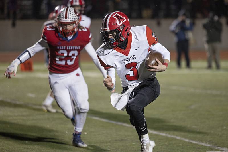 Amboy’s Tucker Lindenmeyer picks up yards Friday, Nov. 18, 2022 in the 8-man championship football game against West Central.