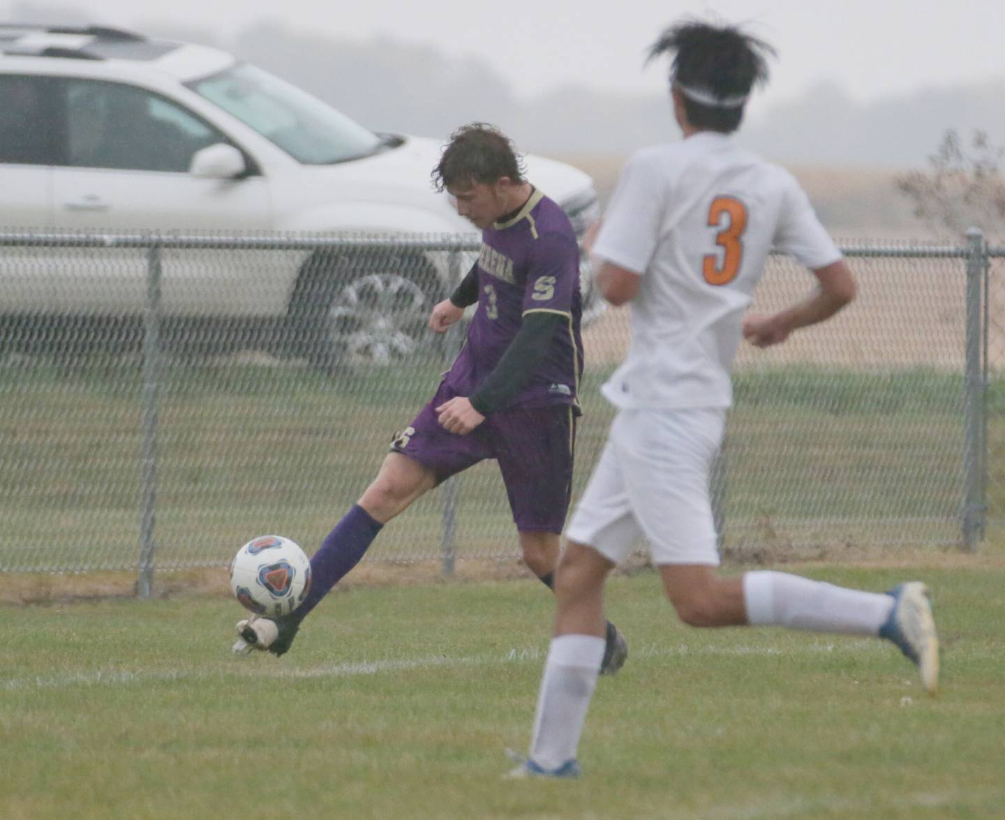 Serena's Hudson Stafford (3) kicks the ball past Sandwich's Nathan Brabey (3) in the Class 1A Regional semifinal game on Tuesday, Oct. 11, 2022 in Serena.