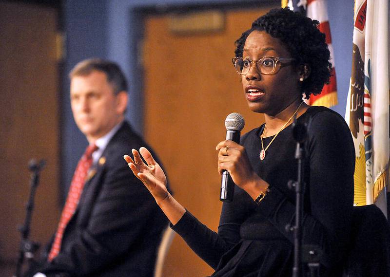 U.S. Rep. Lauren Underwood answers a question as U.S. Rep. Sean Casten listens to her answer Feb. 18 during a town hall meeting at McHenry County College’s Luecht Conference Center.