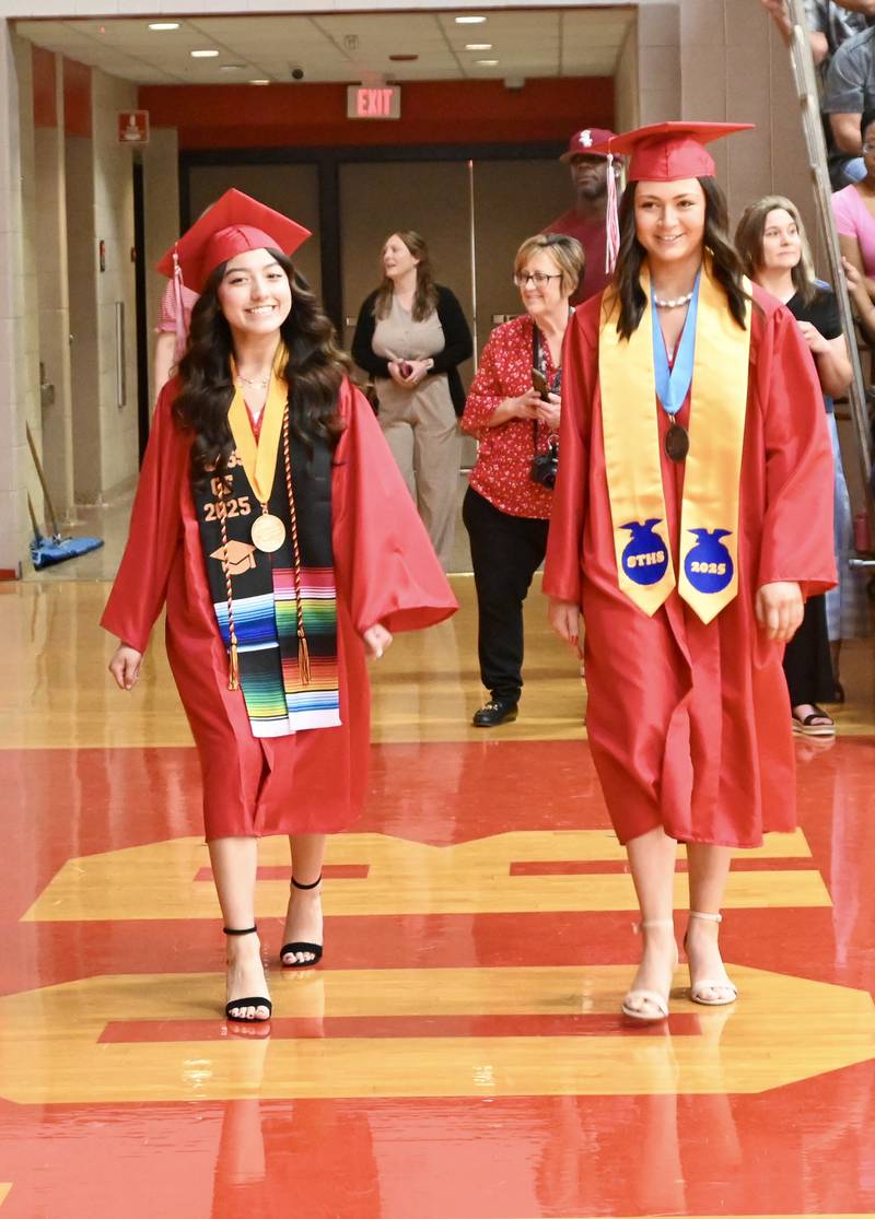 Melanie Moreno and Breanna Perrotta walk during the Class of 2025 Commencement ceremony on Sunday, May 18, 2025 at Streator Township High School.
