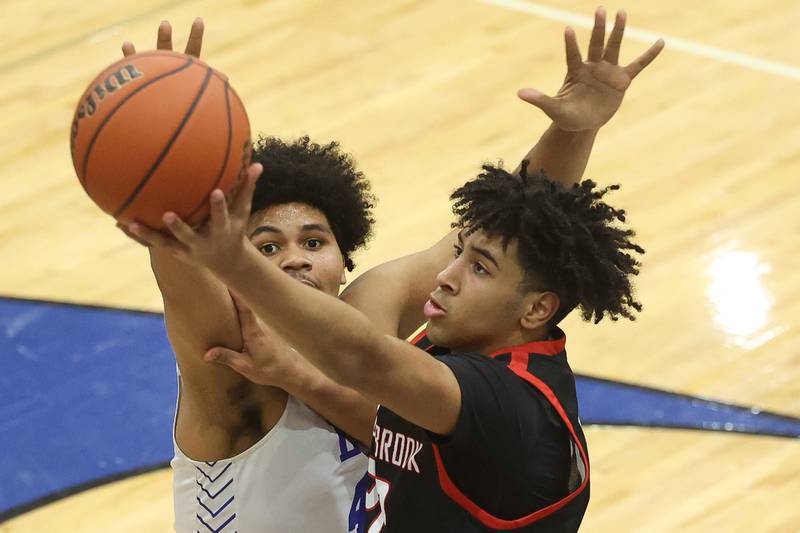 Bolingbrook’s JT Pettigrew puts up a shot against Lincoln-Way East’s Jaylin White on Tuesday, Dec.12th, 2023 in Frankfort.