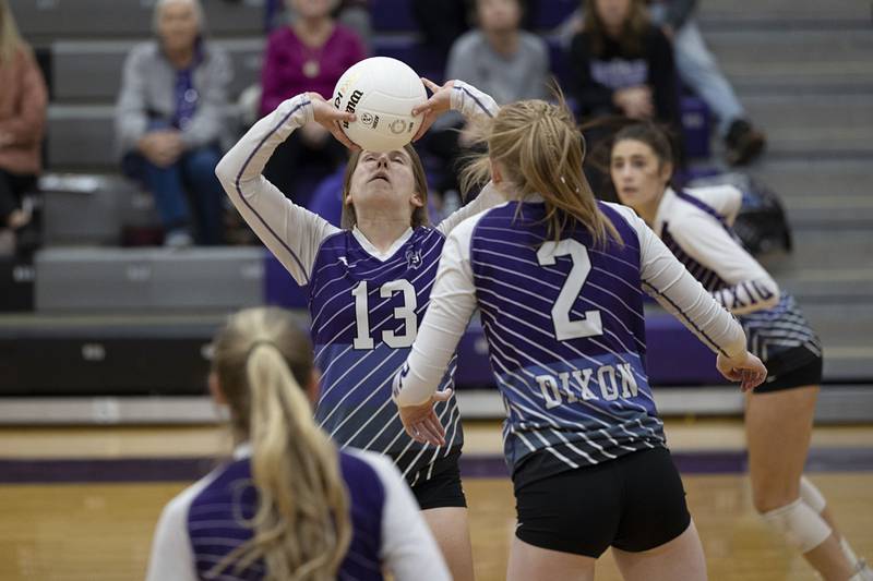 Dixon’s Hanna Lengquist sets the ball Monday, Oct. 17, 2022 against Geneseo.