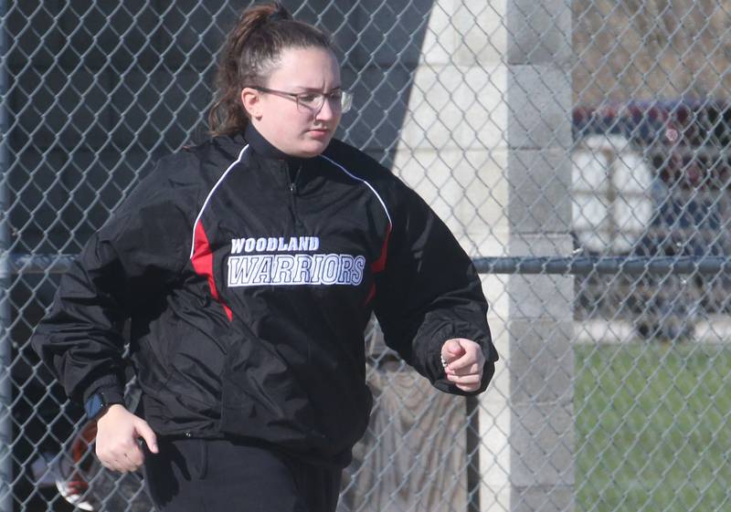 Woodland head softball coach Sydnee Plesko jogs ot the mound to talk to her team while playing St. Bede on Tuesday, April 8, 2025 at Woodland High School.