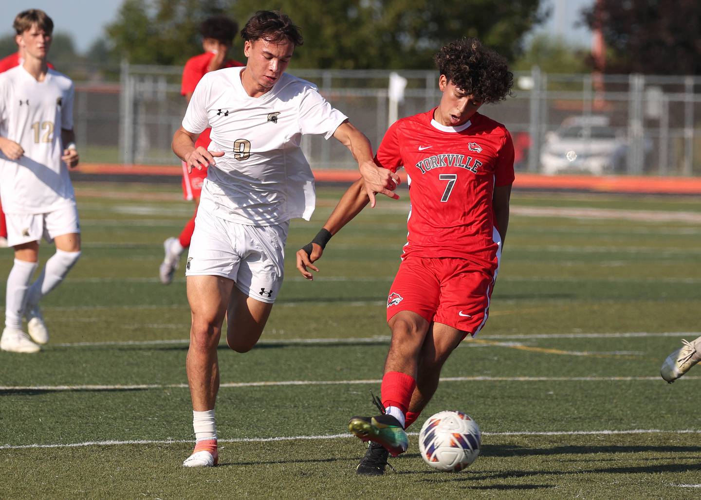 Yorkville's Oliver Villa and Sycamore's Felix Arends battle for possession Thursday, Aug. 28, 2025, during their game in the Barb Cup tournament at DeKalb High School.