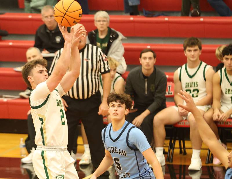 St. Bede's Gus Burr shoots a shot over Bureau Valley's Logan Philhower during the Colmone Classic on Thursday, Dec. 11, 2025 at Hall High School.