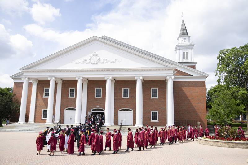 The class of 2024 for Wheaton Academy line up outside of Wheaton College's Edman Chapel before the graduation ceremony  on Sunday, June 2, 2024 in Wheaton.