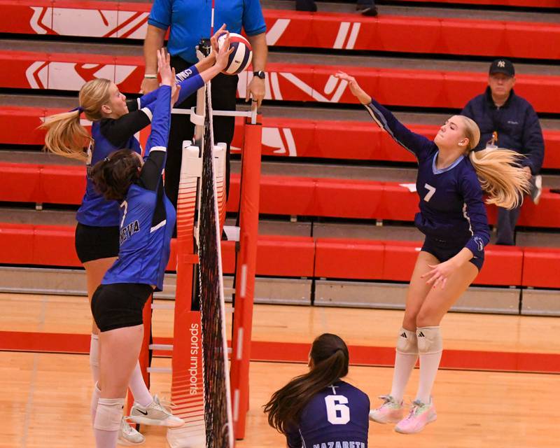 Geneva's Emma Peterson, left, blocks the ball from Nazareth Academy's Lexi Van Eekeren (7) during the sectional title game while Geneva's Jordan Davenport (7) helps on Thursday Nov. 6, 2025, held at Timothy Christian High School.