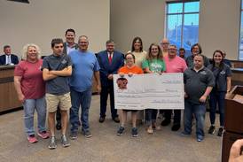 Rhythm & BBQ donates $20,000 to Illinois Valley Industries
