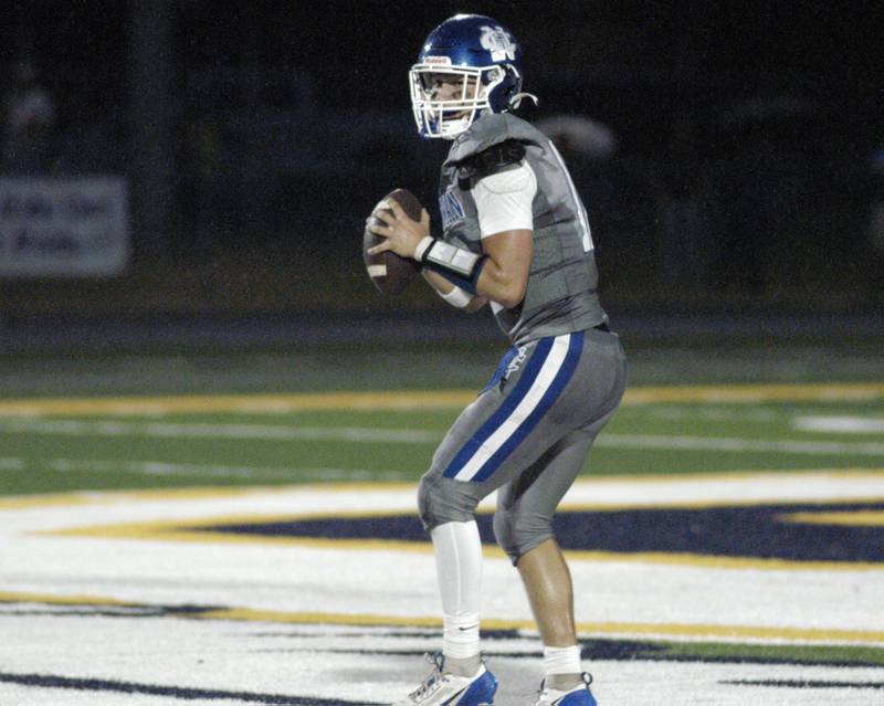 Newman quarterback Evan Bushman drops back to pass. Newman Central Catholic H.S hosted Princeton H.S. in a non-conference football game at Sterling H.S, on Friday, August 29, 2025.
