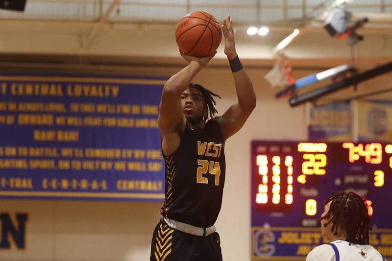 Joliet West’s Jayden Martin puts up a jump shot against Joliet Central.