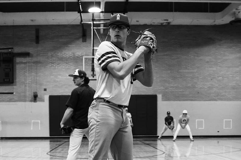 Joliet Catholic’s TJ Schlageter, a Louisville commit, works on pick off moves indoors after their game was rescheduled due to weather on Tuesday, March 14th, 2023 in Joliet.