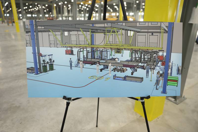 Artist renderings of the Lion Electric assembly lines are displayed throughout the plant during a press conference and interactive tour the new manufacturing facility.. Monday, Mar. 21, 2022, in Joliet.