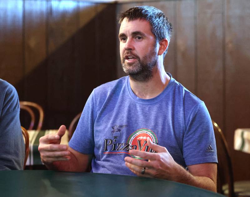 CJ Finn, co-owner of Pizza Villa, talks Monday, Jan. 26, 2026, at the restaurant about owning the business with his dad Joe on Lincoln Highway in DeKalb.