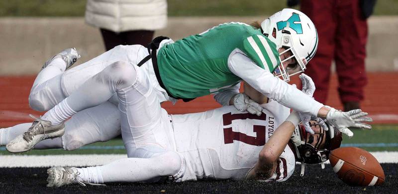 York’s Connor Dorner (17) denies a touchdown pass to Loyola's Declan Forde (17) during the IHSA Class 8A semifinal football game Saturday November 19, 2022 in Elmhurst.