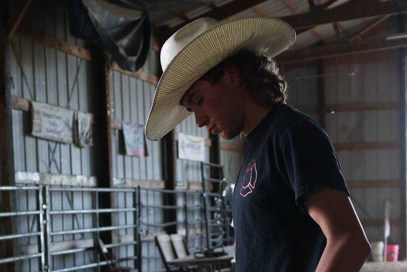 Dominic Dubberstine-Ellerbrock gathers his equipment before practice. Dominic will be competing in the 2022 National High School Finals Rodeo Bull Riding event on July 17th through the 23rd in Wyoming. Thursday, June 30, 2022 in Grand Ridge.