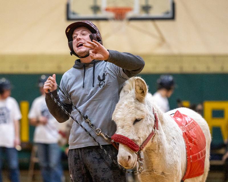 Member of the 'Village Church' team yells at teammate in game of Donkey Basketball on Saturday, Feb. 7, 2026 at Seneca High School West Campus in Seneca.