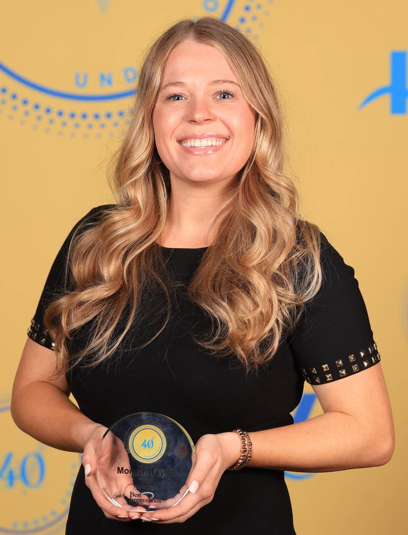 Morgan Taylor poses with her 40 Under Forty award during the Illinois Valley Chamber of Commerce Champions of Change Awards Night on Thursday, April 10, 2025 at the Westclox Event Center in Peru.
