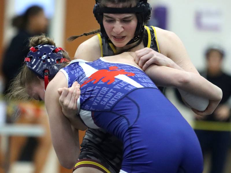 Richmond-Burton’s Madison Lunbar, back, battles St. Viator’s Evalyn Idzik at 110 pounds in IHSA Regional wrestling action on Saturday, Feb. 1, 2025, at  Hampshire High School  in Hampshire.