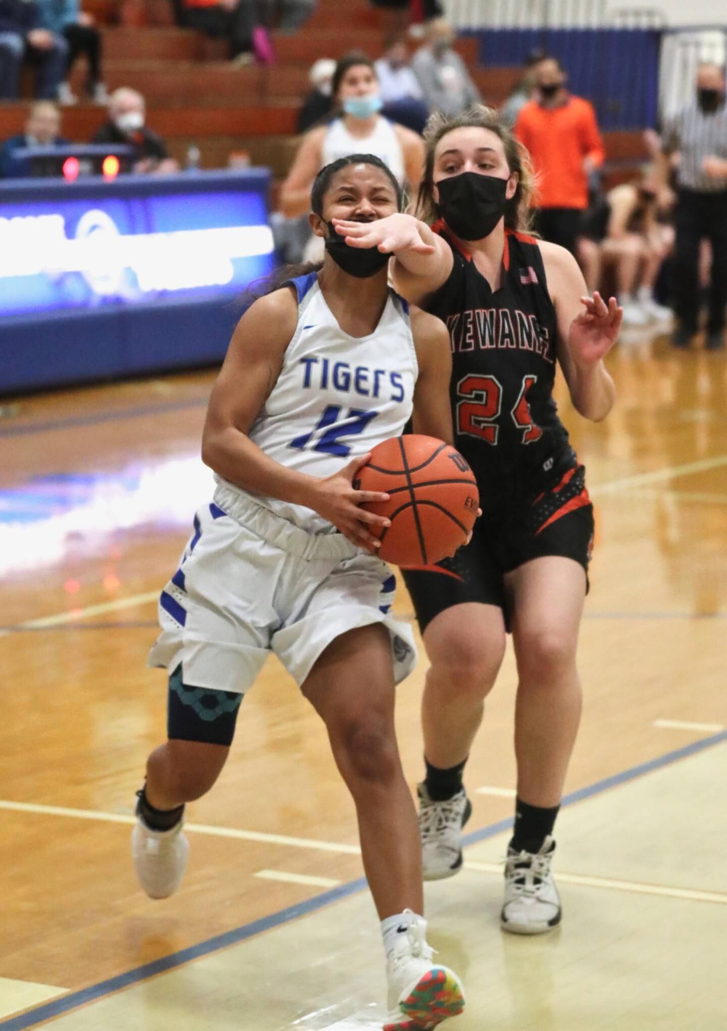 PHS junior Mariah Hobson gets a little facial on a second-half layup against Kewanee Thursday at Prouty Gym.