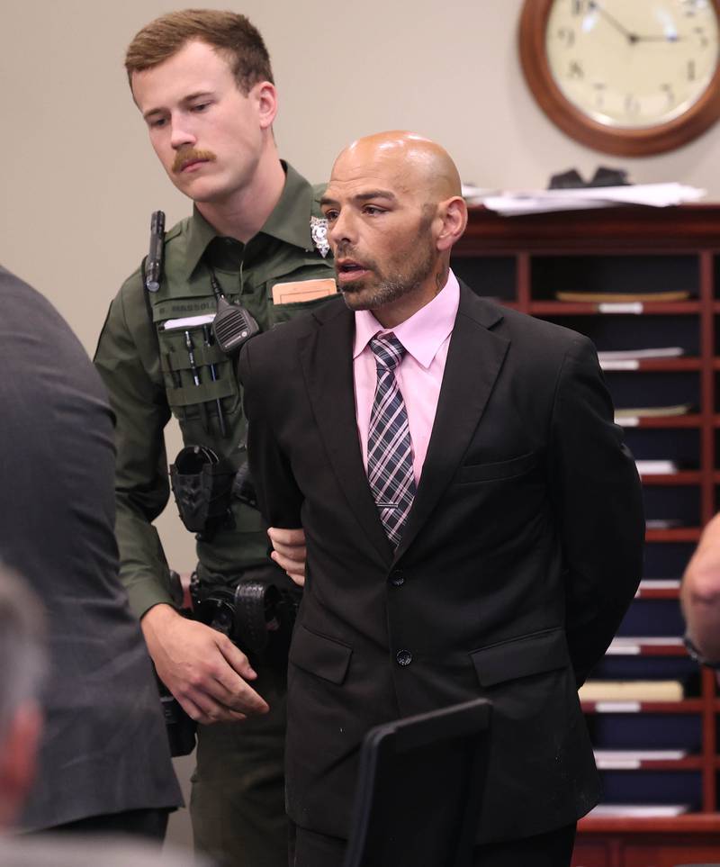 Nathan P. Sweeney is cuffed and led away by an Ogle County sheriff’s deputy Tuesday, Aug. 26, 2025, after his sentencing at the DeKalb County Courthouse in Sycamore. Sweeney received the maximum 14 years for driving under the influence and causing the 2024 crash that killed DeKalb County sheriff’s deputy Christina Musil.