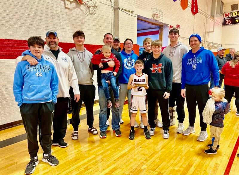 Princeton Tiger football coach Ryan Pearson (left) and players and coaches attended Friday's BVEC championship game in Malden in support of fellow Tiger coach Nick Lower and his Malden Musketeers.