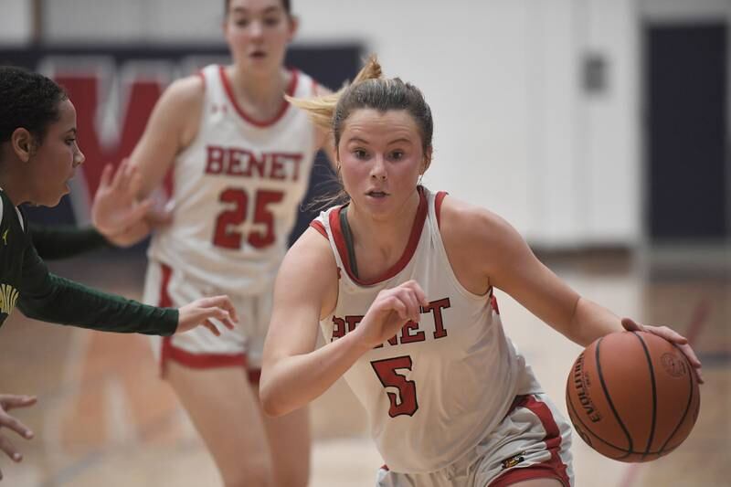 Benet's Lenee Beaumont drives against Waubonsie Valley's Arianna Garcia-Evans in the Class 4A West Aurora girls basketball all sectional championship game in Aurora on Thursday, February 23, 2023.