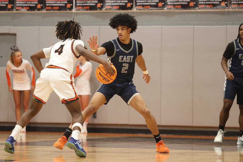 Oswego East’s Jacsen Tucker applies pressure against Minooka’s Nehemiah Brown on Friday, Jan. 16, 2026 in Minooka.