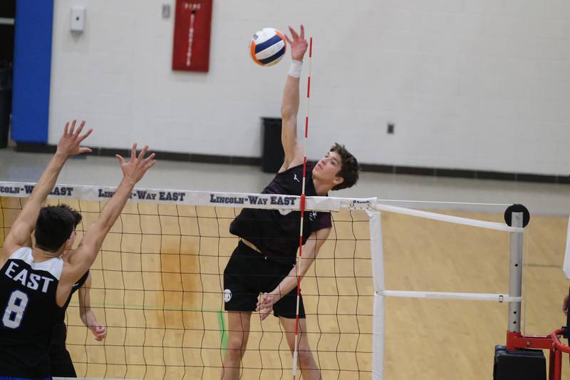 Lockport’s Matthew Krozos stretches for the kill against Lincoln-Way East in the Lincoln-Way East Tournament 3rd place match. Saturday, April 30, 2022, in Frankfort.