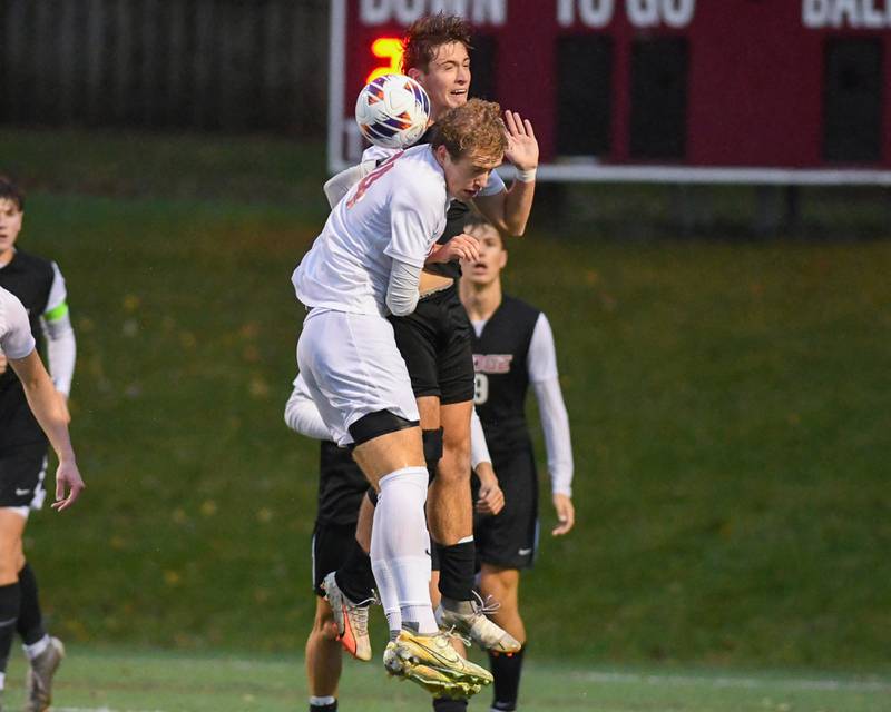 Benet Academy's Jack Kuelthau, front, and Prairie Ridge's Samuel Kirk, go up to head the ball during the class 2A super sectional soccer match on Tuesday Nov. 5, 2024, held at Wheaton Academy in West Chicago.