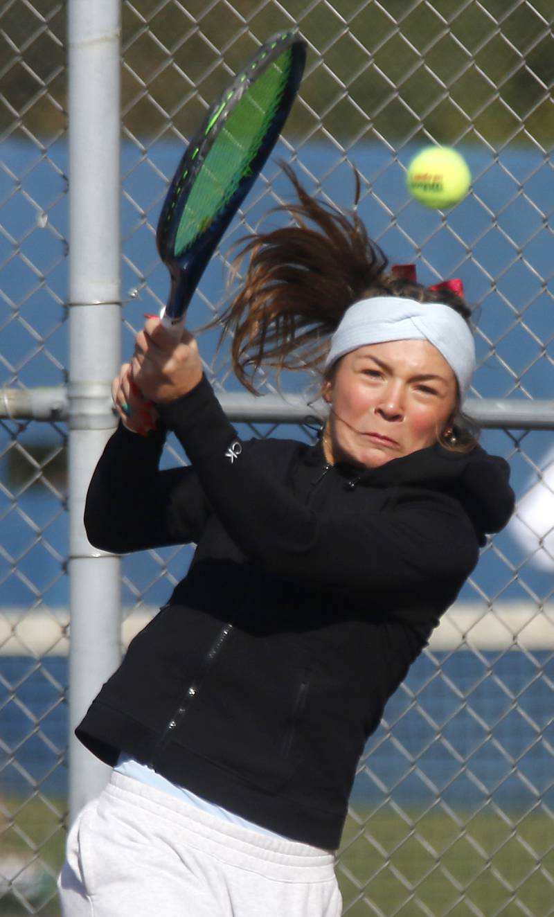 Marian Central’s Jenna Remke returns the ball Thursday, Oct. 23, 2025, during the first day of the IHSA State Girls Tennis Tournament at Schaumburg High School.