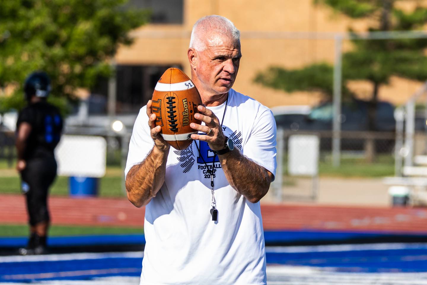 Coach Rob Zvonar leads varsity football practice at Lincoln-Way East on Aug. 11, 2025.