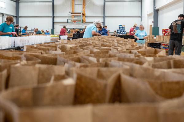 Sherman’s marks 50th anniversary with meal-packing event for hungry children