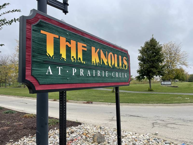 A sign outside of The Knolls subdivision in DeKalb
