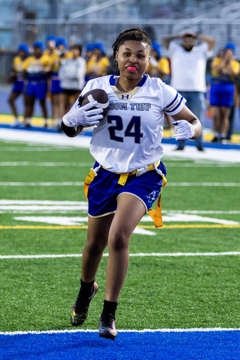 Bloom’s Roniyah Hayes scores a touchdown during a varsity flag football game at Joliet Central on Sept. 11, 2025.
