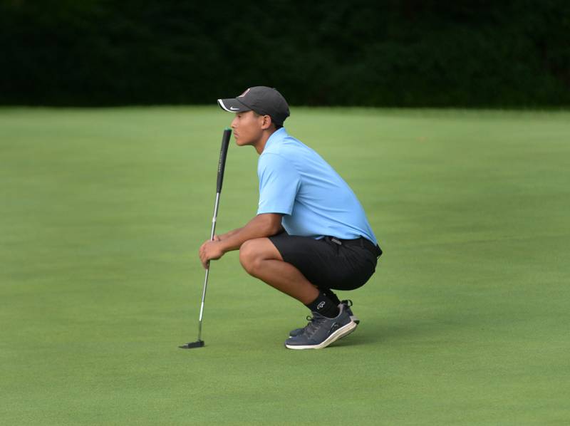 Oregon's Matthew Pham waits to putt during a Monday, Aug. 18, 2025 match with Erie-Prophetstown at Silver Ridge Golf Course north of Oregon.