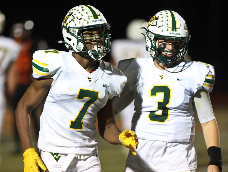 Waubonsie Valley's Tyler Threat (left) and Luke Elsea celebrate a touchdown during their game Friday, Sept. 29, 2023, at DeKalb High School.