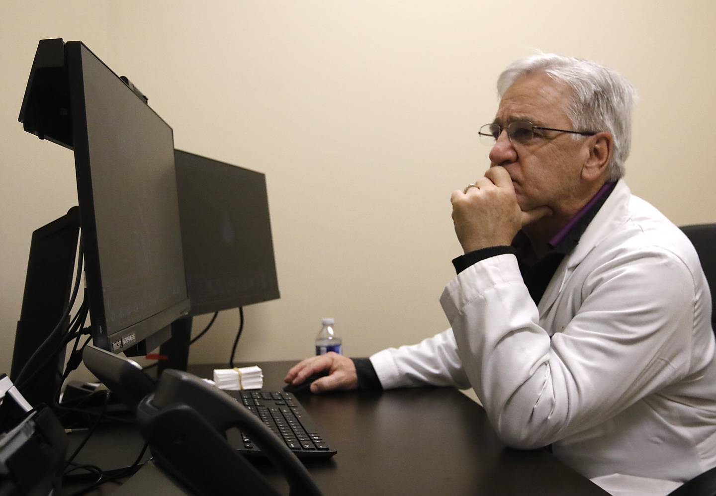 Dr. Michael Caron of Northwestern Medicine McHenry Hospital looks at an image of a brain tumor on Thursday, Jan. 18, 2024, in the Northwestern Medicine Huntley Hospital medical office building.