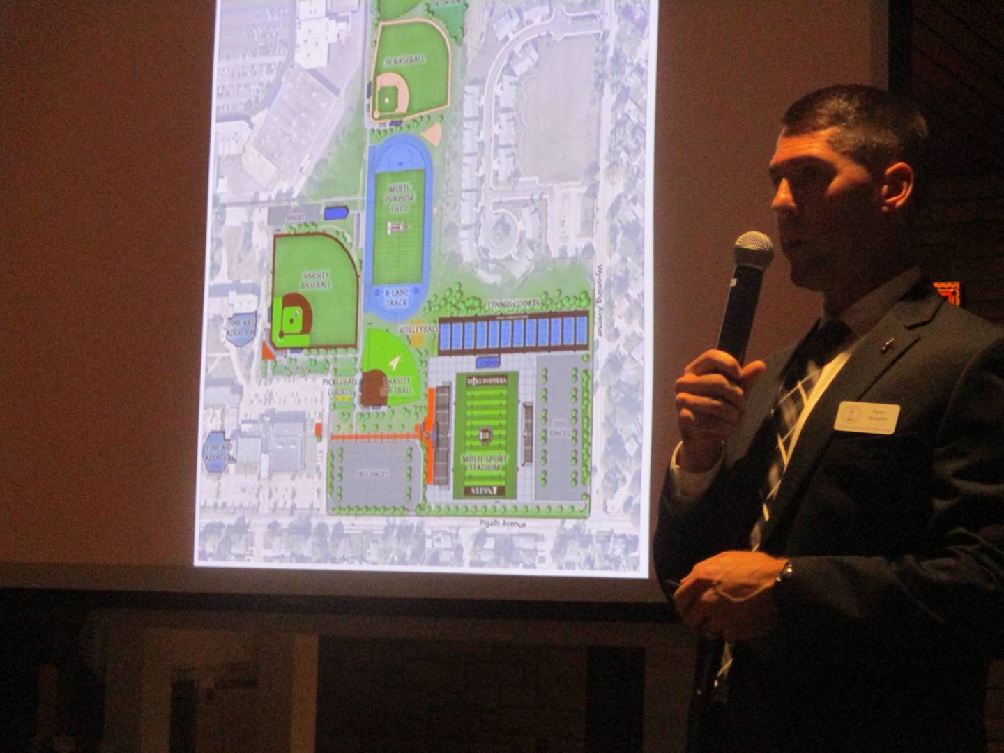 Ryan Quigley, institutional advancement director at Joliet Catholic Academy, shows the school's plans for expanding its athletic facilities at a community meeting on Wednesday. Sept. 24, 2025