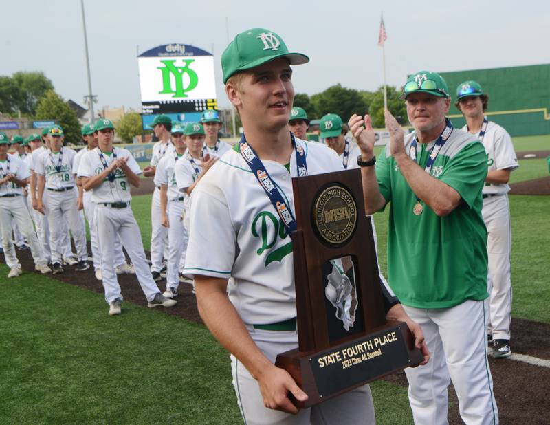 Joe Lewnard/jlewnard@dailyherald.com
York’s Jack Rozmus holds the Dukes’ fourth-place trophy following the Class 4A state third-place baseball game in Joliet Saturday.